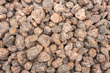 Granite red gravel. A lot of small stones. Creative vintage background.