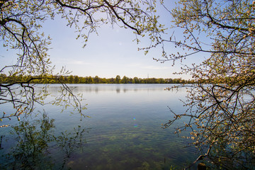 Fototapeta premium Beautiful, blue and deserted Unisee - a lake in Bremen at sun and blue sky