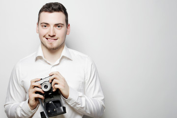 young photographer over white background