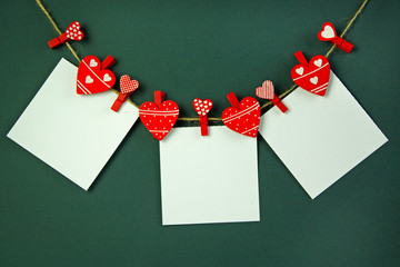 greeting card on clothespins in the shape of a heart with place for text, holiday concept