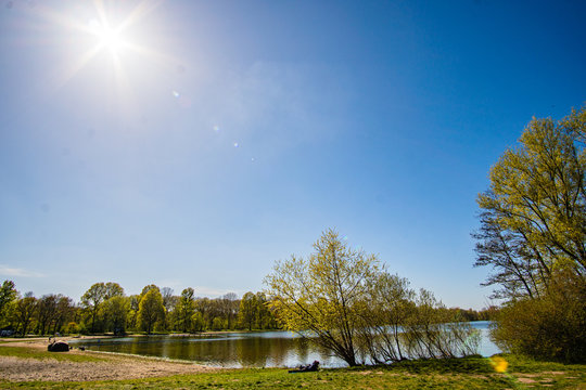 Beautiful, blue and deserted Unisee - a lake in Bremen at sun and blue sky