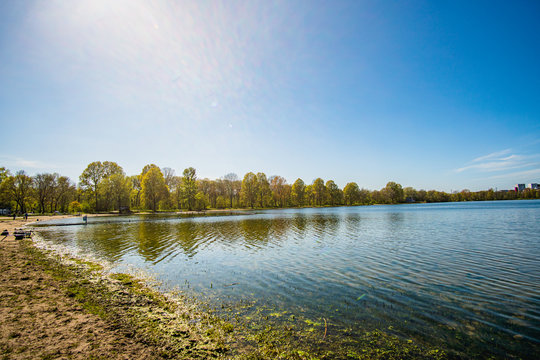 Beautiful, blue and deserted Unisee - a lake in Bremen at sun and blue sky