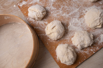 Female hands mixing dough in the home kitchen.