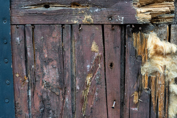 old rotten door boards and clogged rusty nails