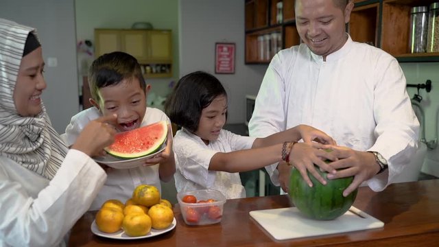 muslim asian family and kids preparing for fasting break on ramadan