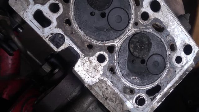 Obsolete valves in the engine block of an old car. This 1920x1080 (HD) bit of footage is fitting to use in any project that depicts car service, cars and car industry.