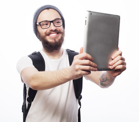 young bearded man holding tablet