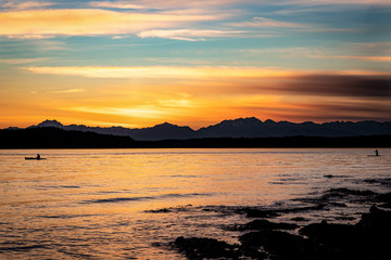 Kayakers at sunset over Puget Sound