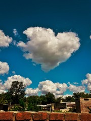 heart-shaped cloud over a city