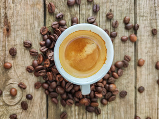 Cup and grain of coffee