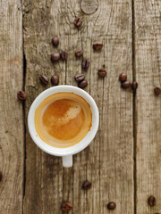 Cup and grain of coffee