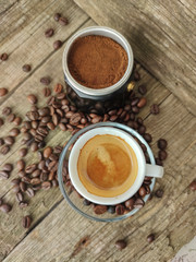 Cup and grain of coffee