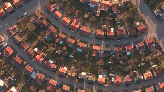 Aerial top down view of residential neighbourhood area showing rows of houses