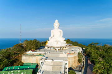 Vesak day background concept of Big buddha over high mountain in Phuket thailand Aerial view drone shot.