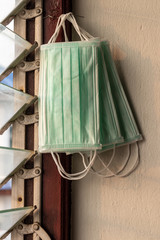 Many masks-hygiene hung near the louver window.