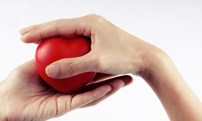 Woman hand holding red heart, health care, donate and family insurance concept, world heart day, world health day,CSR responsibility, adoption foster family, hope, gratitude, kind, concept