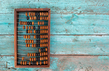 Old wooden abacus top view copy space