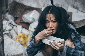 poor people,homeless or beggar begging for help sitting at dirty slum.concept for poverty...