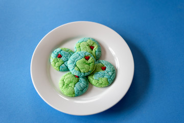 Top view of plate of cookies shaped like planet earth - 341853492