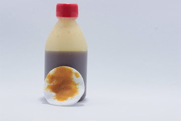 medical wound cream and cotton on white background