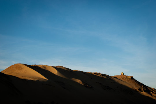 Sand dunes at sunset by the Nile in Aswan, Egypt