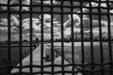 City view behind fence
