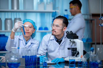 Health care researchers working in medicals science technology research in laboratory