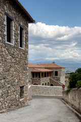 Fototapeta na wymiar Street with stone houses in the village close-up