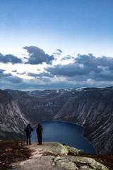 The trailhead for hiking to Trolltunga as hikers overlook the beautiful Fjords of Norway
