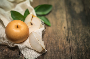 Snow pear or Korean Snow pear fruits on wooden background,Snow pear or Fengsui pear on a wooden background delicious and sweet,