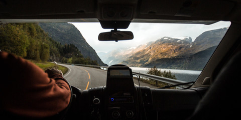 Driving through the winding roads Along the Fjords of Norway in an RV Camper Van 