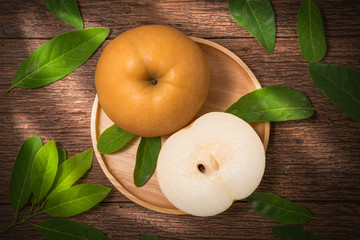 Snow pear or Korean pear on a wooden background, Nashi pear fruits delicious and sweet