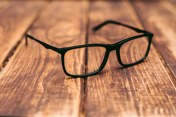 Glasses for sight and vision correction and protection from computer on the wooden table