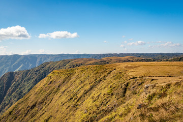 misty mountain range covered with white mist and amazing blue sky