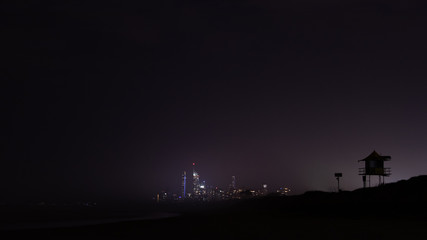 Beachside city at night