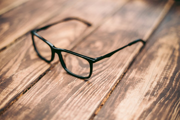 Glasses for sight and vision correction and protection from computer on the wooden table