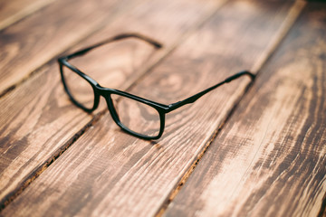 Glasses for sight and vision correction and protection from computer on the wooden table