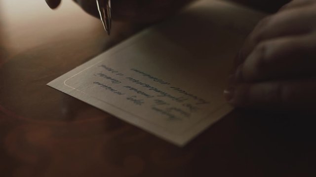 Writing notes on the paper in the diary, wedding traditions, writing wedding vows, frontview