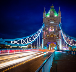 Famous Tower Bridge over themes river London at night London, Aerial view to the illuminated Tower Bridge and skyline of London