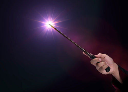 Magic wand on mysterious background, Miracle magical stick Wizard tool on black