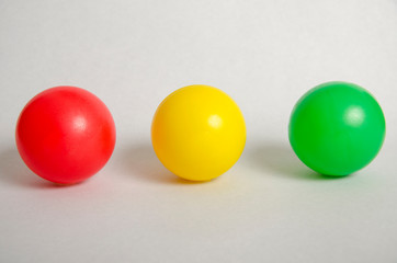 Line of  three traffic light balls  on White background