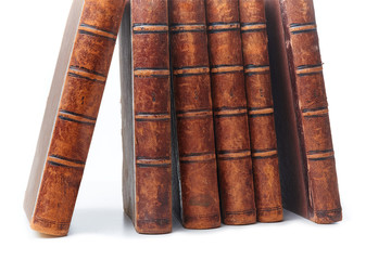 Stack of nine antique books, isolated white background