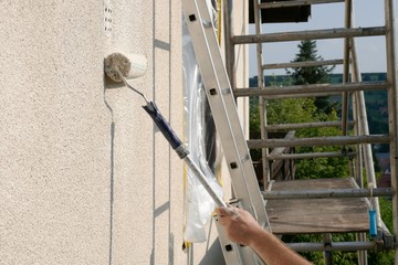 painting walls.Repair and construction concept.Details of painting walls, roller,staircase,...