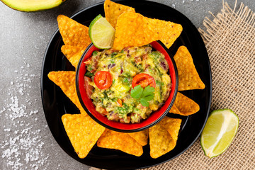 Homemade guacamole with corn chips. Healthy food.
