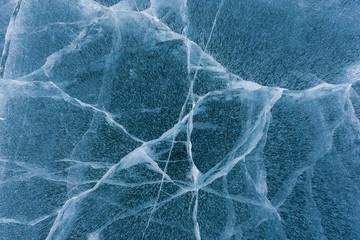 Beautiful ice of Lake Baikal with abstract cracks