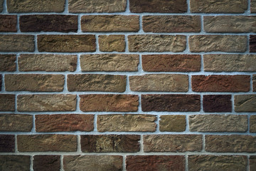 Brick wall made of textured decorative brick.
