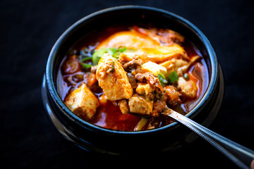 Korean spicy silken tofu stew which is called Sundubu Jjigae