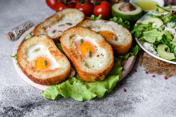 Delicious breakfast with grunts, eggs, avocado and cherry tomatoes