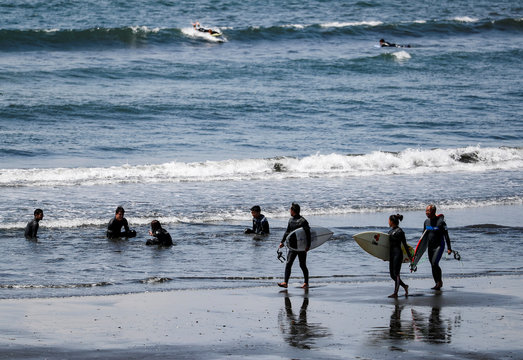 Surfers are seen during the spread of the coronavirus disease (COVID-19) continues in Fujisawa, Kanagawa Prefecture, Japan