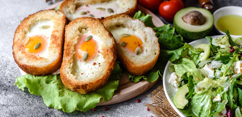 Delicious breakfast with grunts, eggs, avocado and cherry tomatoes
